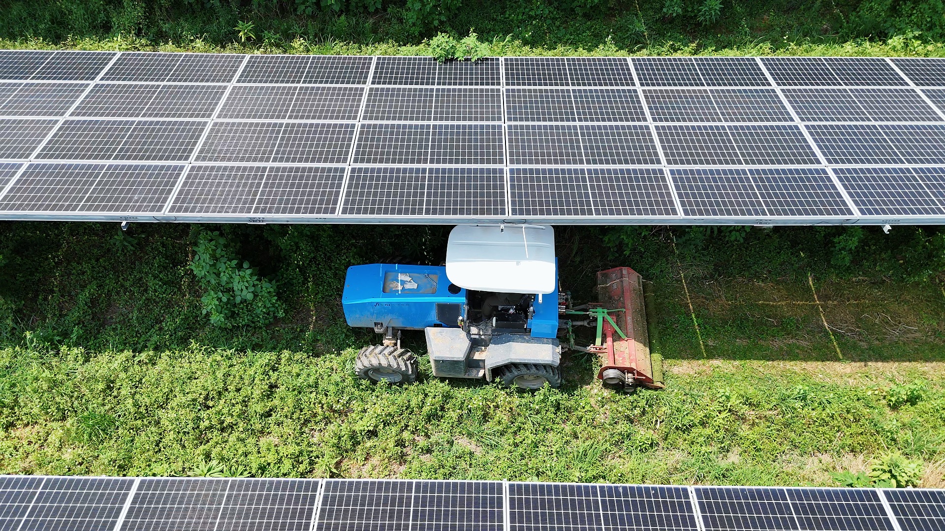 VF100E full-size electric tractor aerial view under solar panels